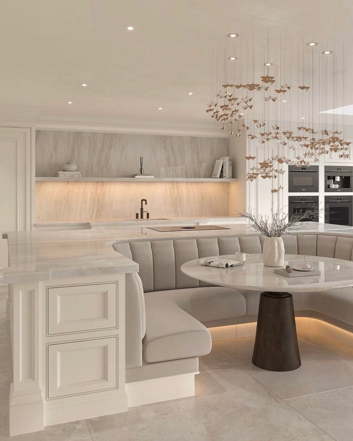 Kitchen with butterfly chandelier and banquette by Lance Interiors